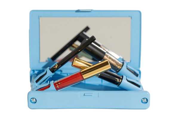 MISS SWISS Blue Hydrangea Makeup Case holding MISS SWISS Makeup
