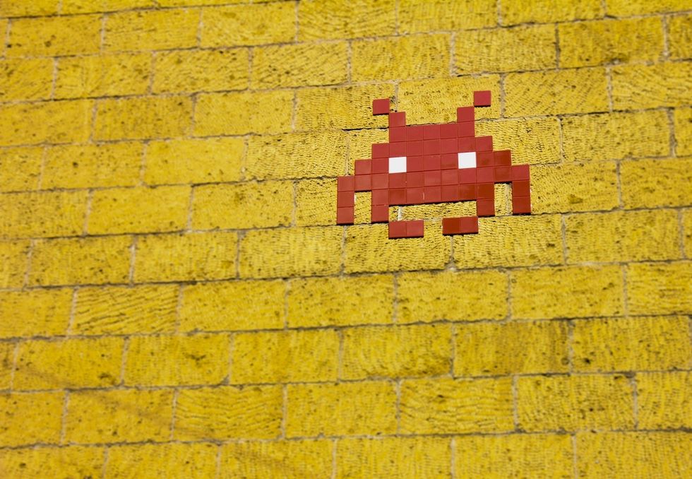 Mosaic alien on wall