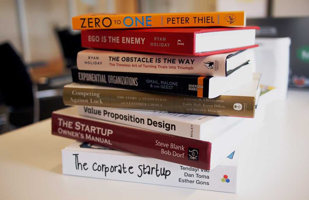 Multiple books stacked on top of each other