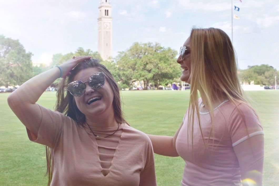My friend and me in front of memorial tower at LSU