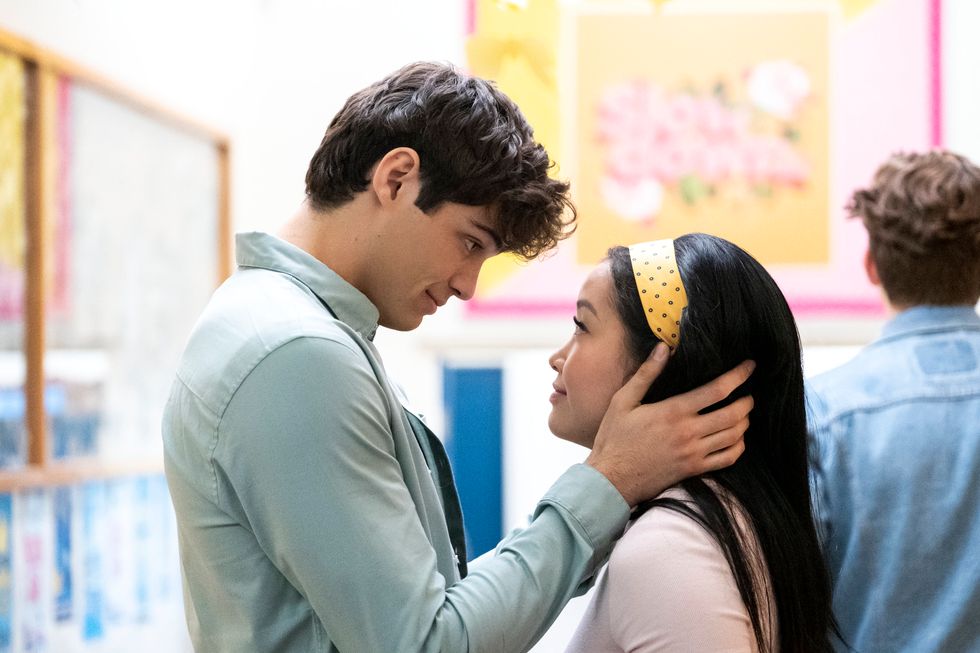 Noah Centineo as Peter Kavinsky (on the left) cups his hands around Lana Condor's face as Lara Jean in the Netflix original movie "To All the Boys: P.S. I Still Love You."