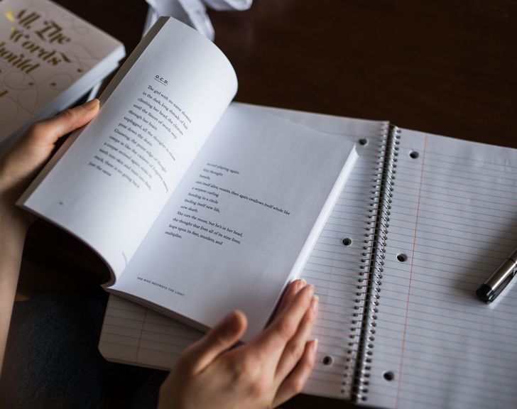 Open Book, Hands, Notebook, and Pen