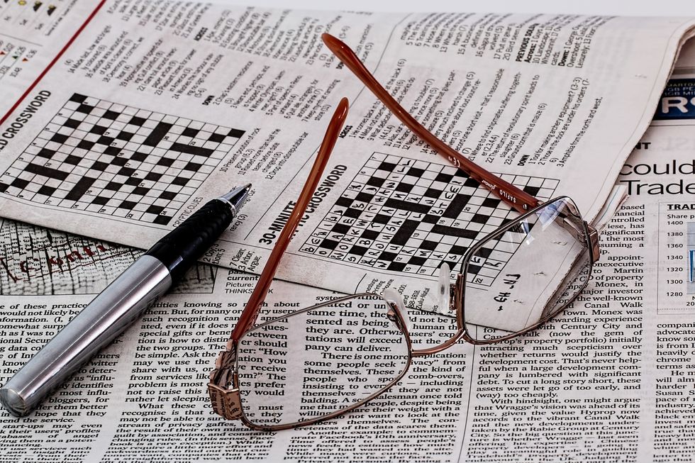 pen, newspaper, glasses