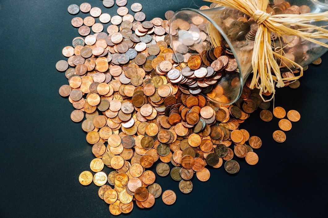 Pennies spilling out of a jar