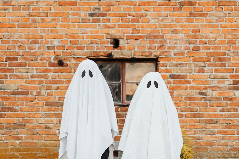people dressed up as ghosts
