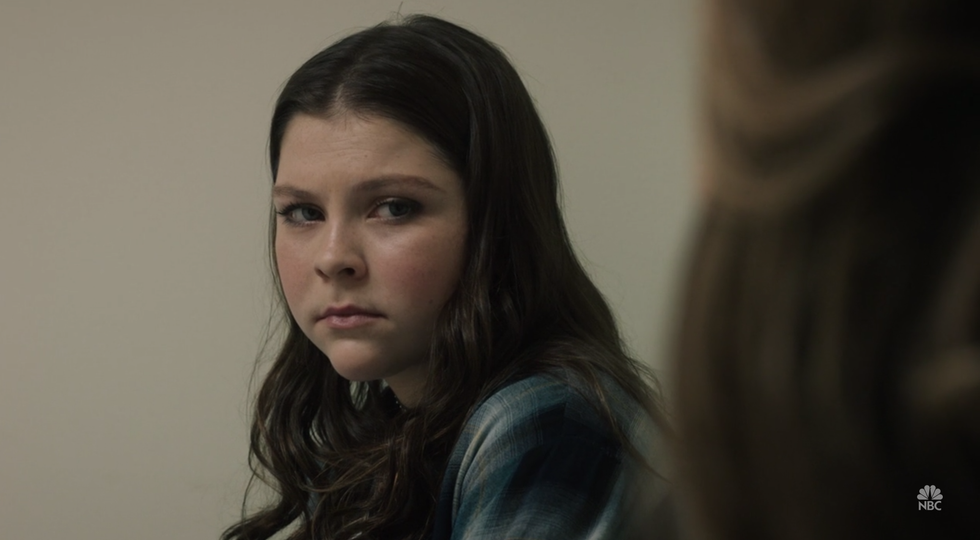 Person holding measuring tape to their waist