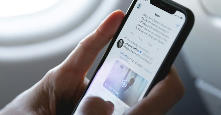 person holding space gray iPhone X