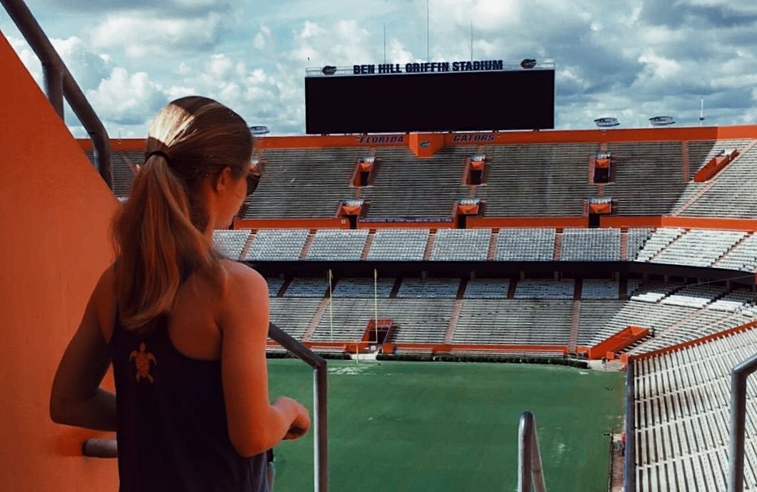 person laying in the Plaza of the Americas, Gainesville, Florida