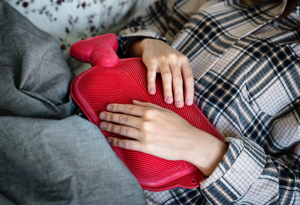 person with a hot water bottle