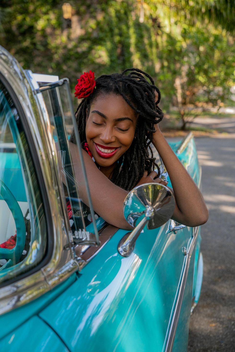 Photo by RODNAE Productions: https://www.pexels.com/photo/a-woman-touching-her-hair-while-sitting-in-a-blue-car-8249892/