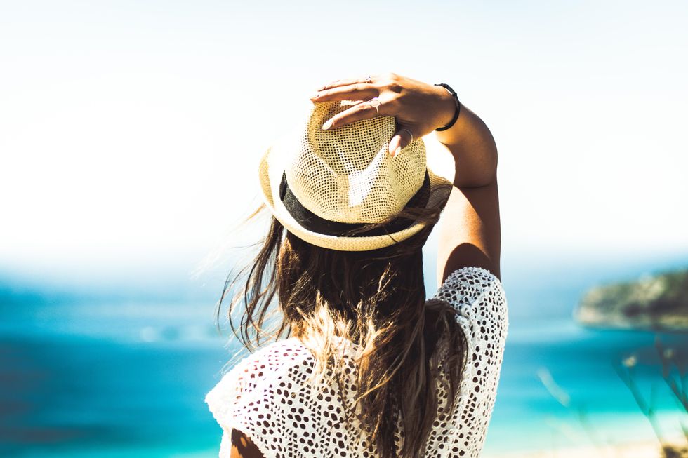 Photo of girl overlooking ocean. 