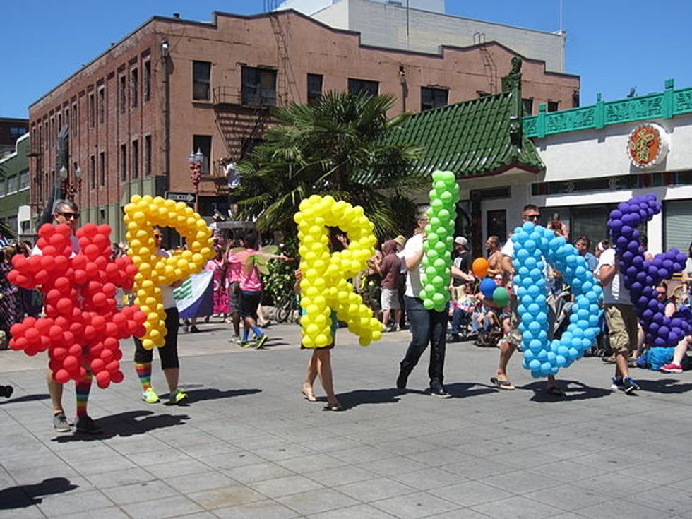 (pictured: rainbow balloons spelling out "#PRIDE")