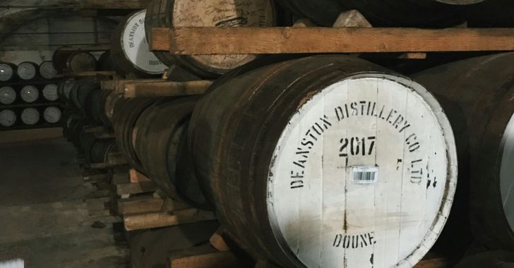 pile of oak barrels inside tunnel