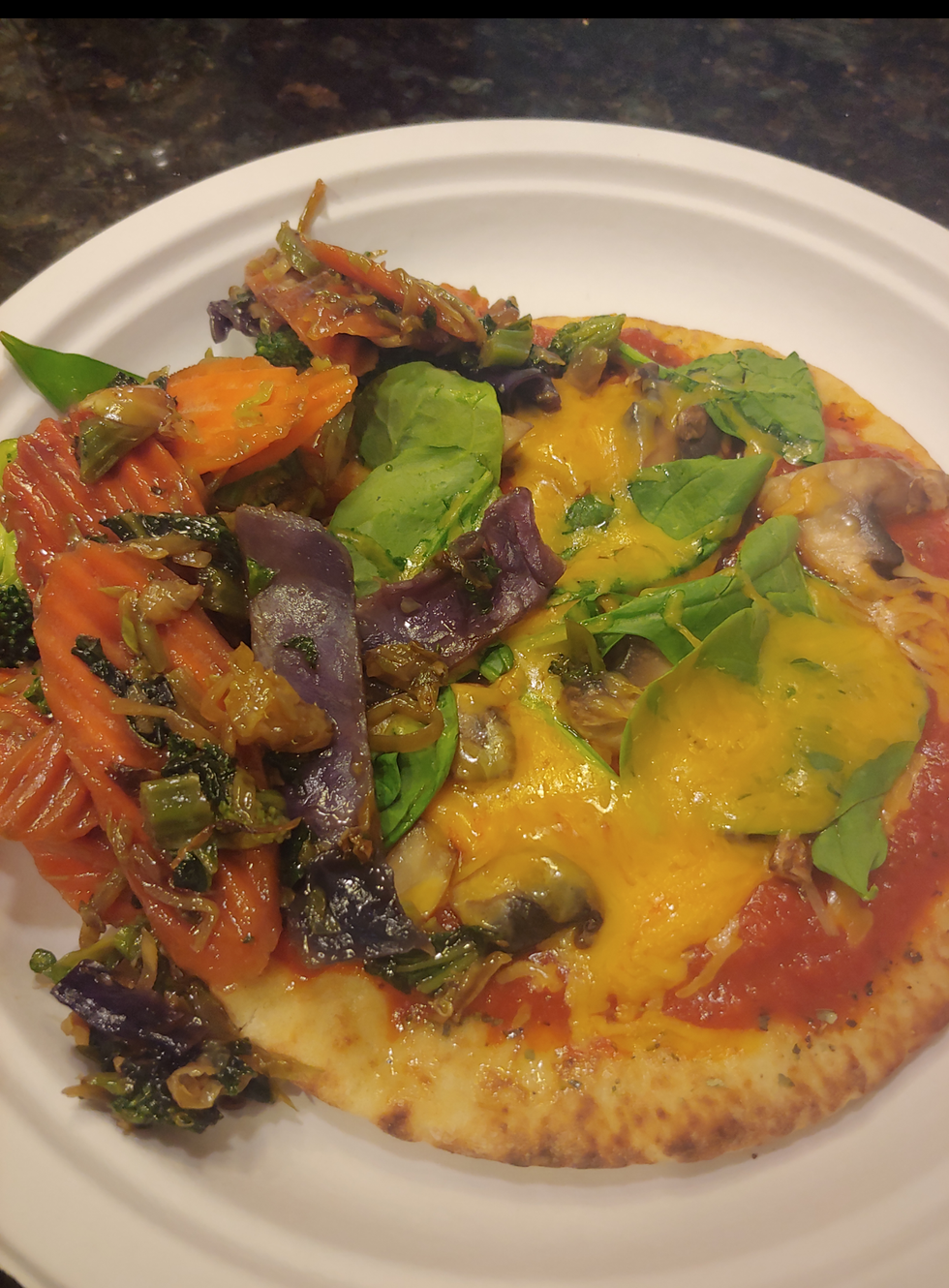 pita bread pizza with a side of veggies