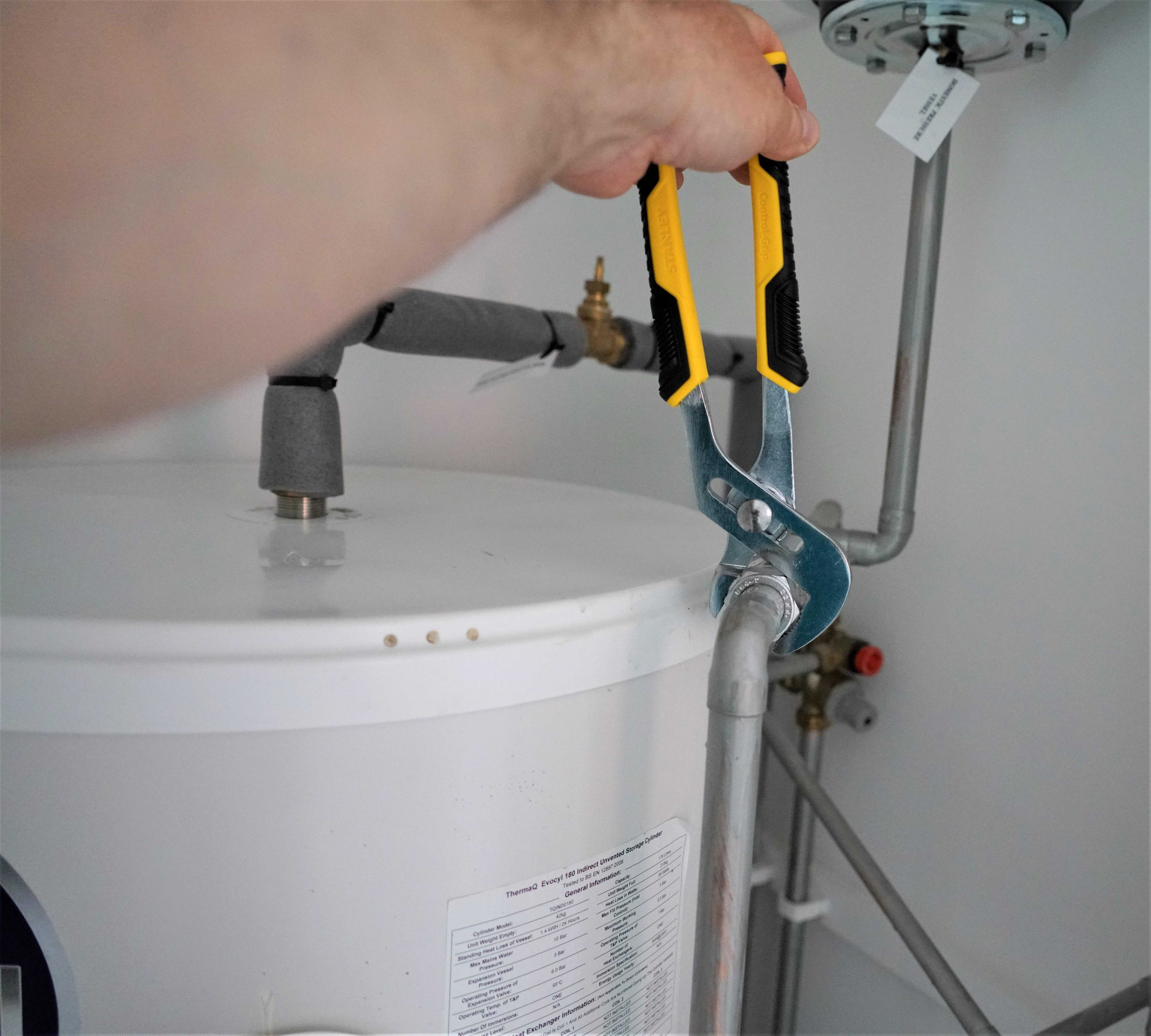 plumber doing repair a water pipeline
