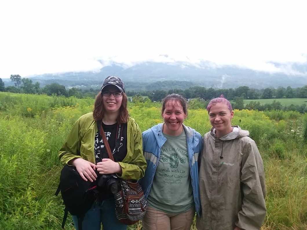 posing in front of vermont landscape