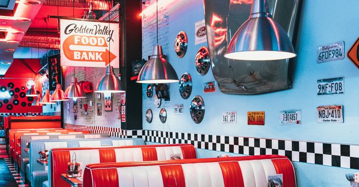 red padded sofa and tables inside building