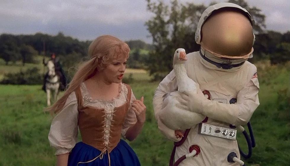 renaissance woman talking to astronaut holding duck