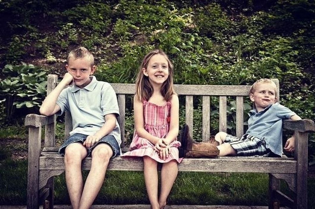 siblings on bench