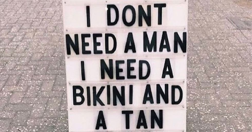 sign saying "I don't need a man."