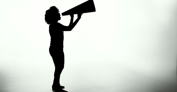 silhouette of woman holding rectangular board
