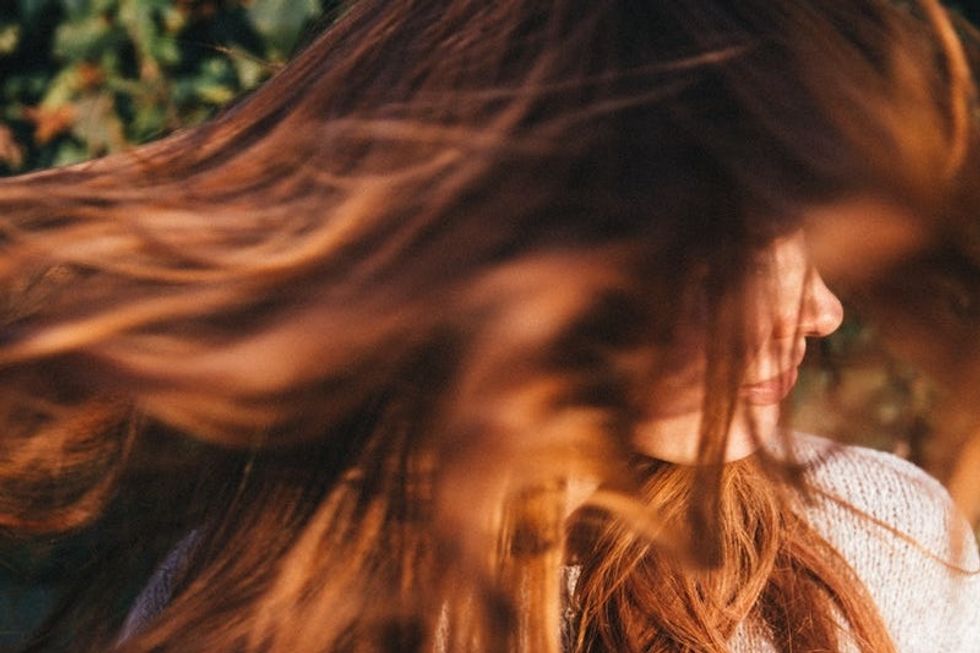 single woman with long red hair