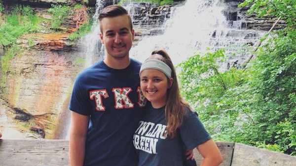 smiling college girlfriend with handsome frat boyfriend