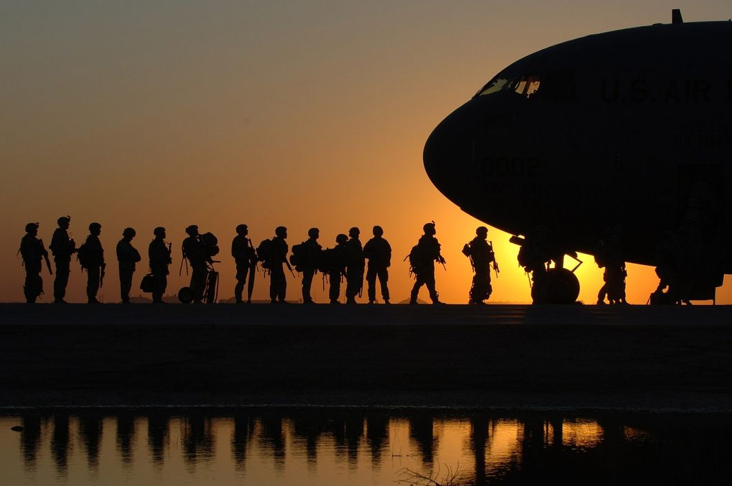 soldiers boarding plane