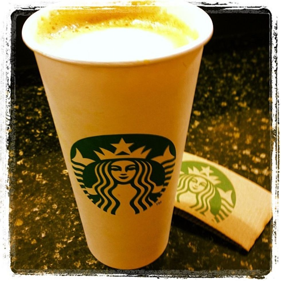 starbucks cup with latte in it