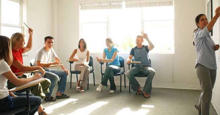 students in a classroom setting with teacher