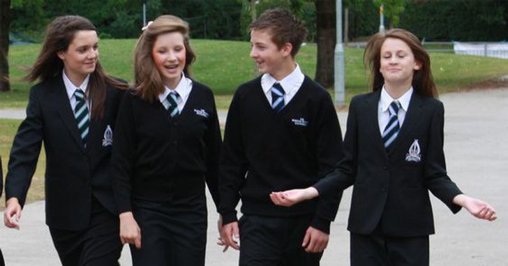 students walking in all black uniform