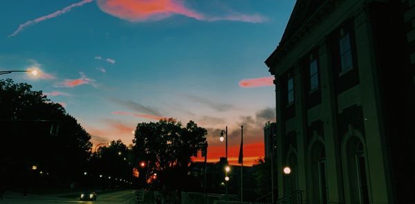 Sunset pictured behind entrance to the church that is connected to Newman Hall, the Catholic dorm that is discussed in this article.