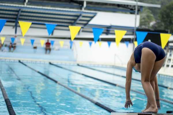 Swimmer taking her mark.