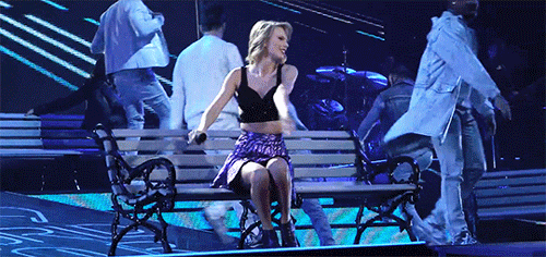 taylor swift stands up from bench