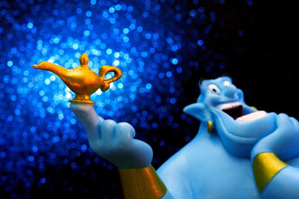The Aladdin Genie holding the magic lamp