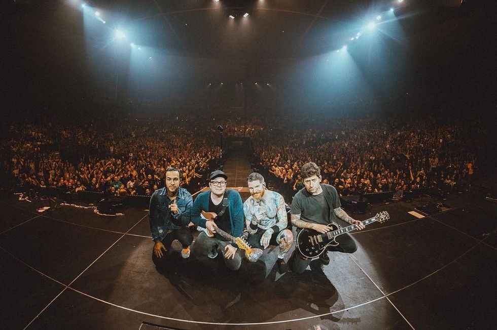 The band Fall Out Boy, known for its epic lyrics, poses for a group picture