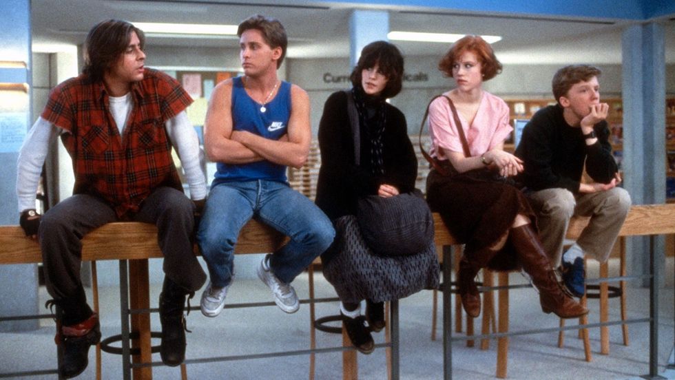 The Breakfast Club movie - group of teenagers sitting on a workbench