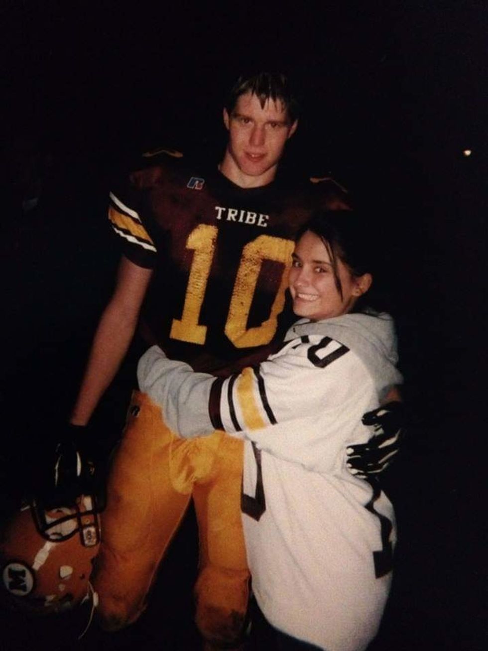 This is a photo of my husband and I just after one of his football games in High School.