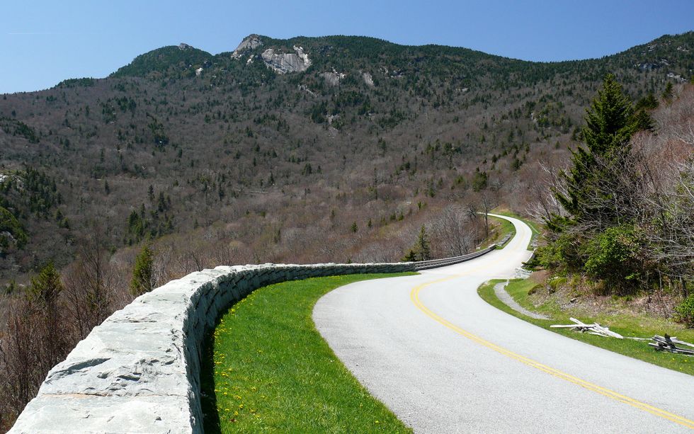 This is an image of a winding road in the mountains.