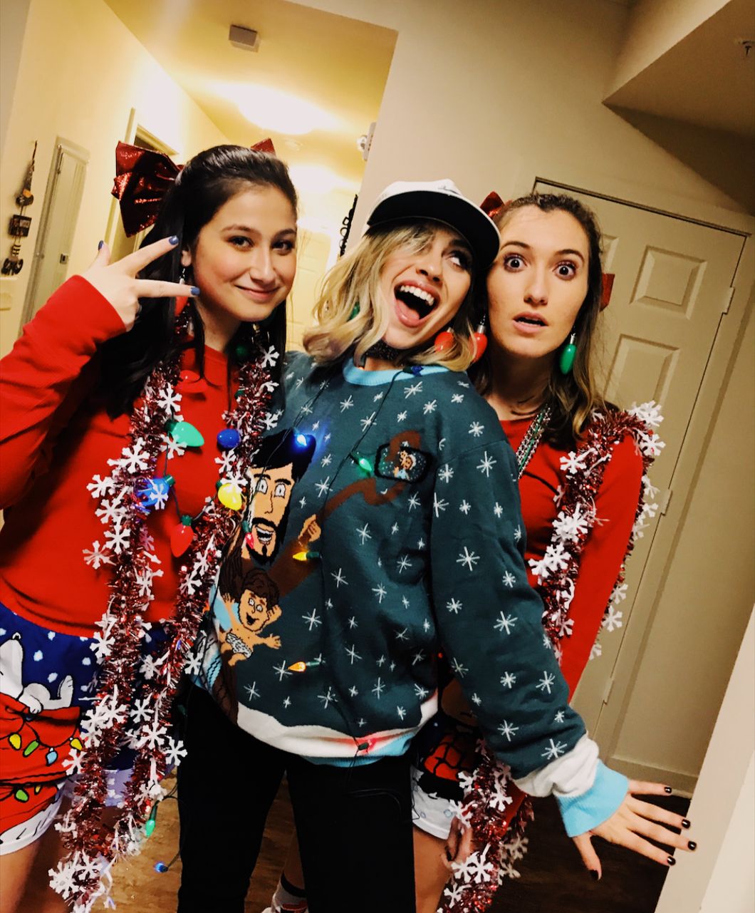 Three girls in Christmas crazy outfits