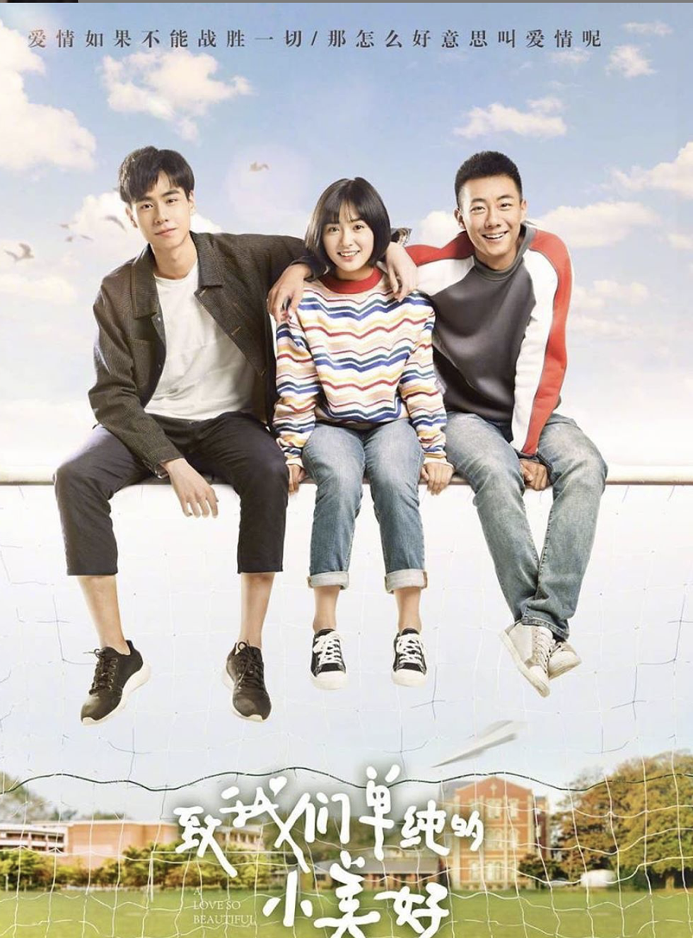 three people on a soccer net