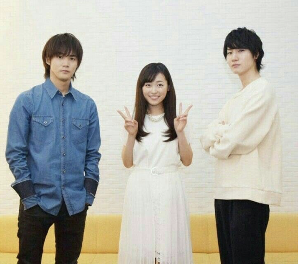 three people standing