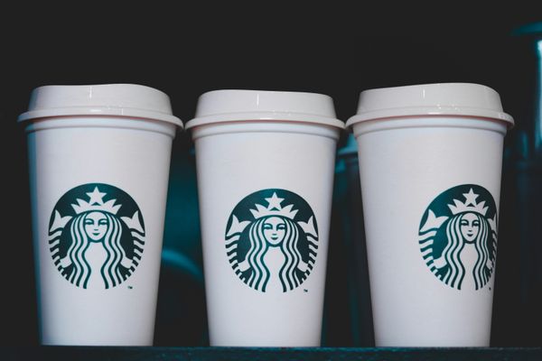 three white starbucks disposable cups