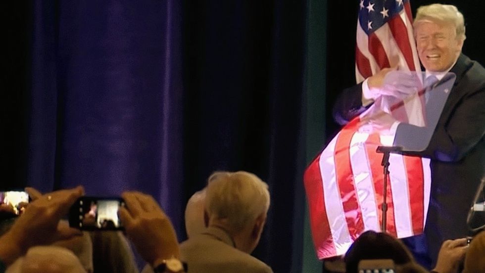trump hugging flag