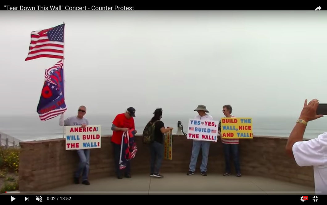 Trump tower with a man standing in front.