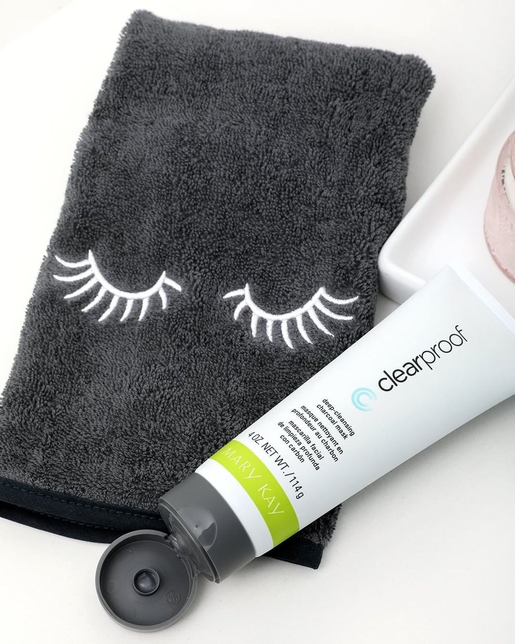 tube of deep-cleansing charcoal mask and face cloth