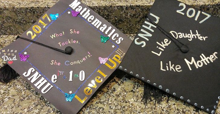 Two Graduation Caps, decorated. The first one says 2017 Mathematics, SNHU, Level Up, Miss You Dad, "What she Tackles, She Conquers!" Second Says, "SNHU 2017 Like Daughter, Like Mother"