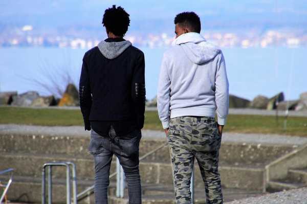 Two men walking and talking