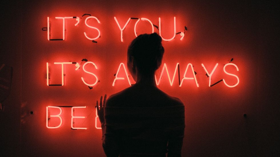 Two older girls on swings at a local park