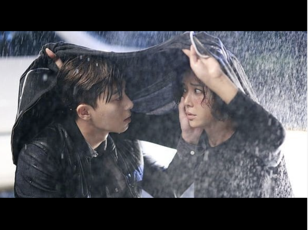 two people in the rain